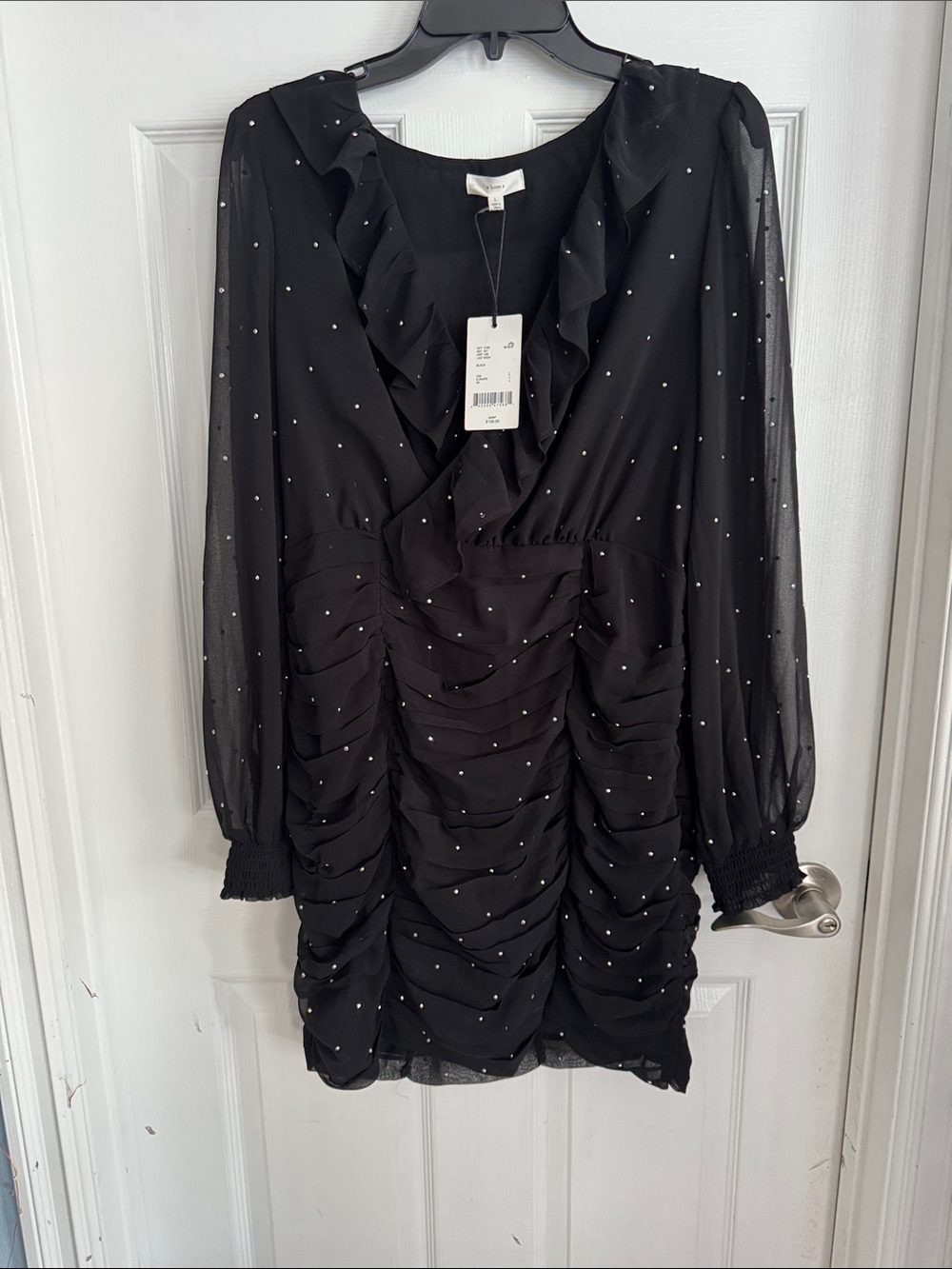 Ruffled V-Neck Black Mini Dress with Subtle Sparkle